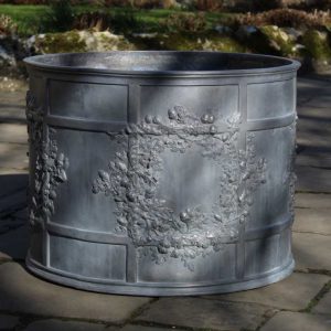 LARGE OAK GARLAND ROUND LEAD CISTERN
